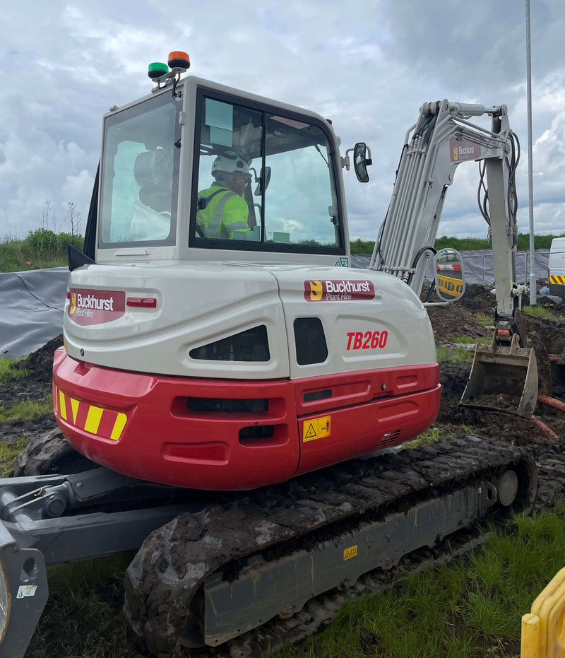 6 tonne excavator with Buckhurst branding on a construction site