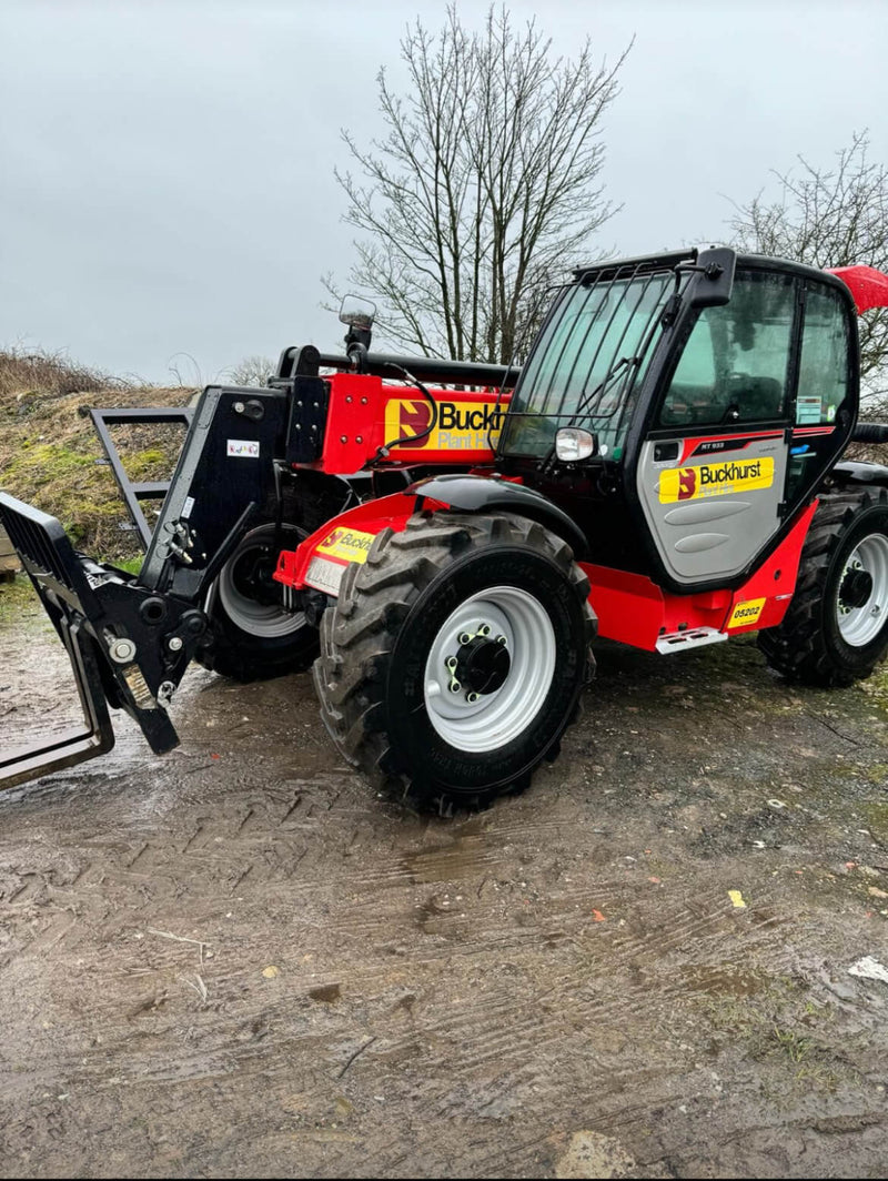 Red and black telescopic handler with 'Buckhurst Plant Hire' branding on a muddy ground.